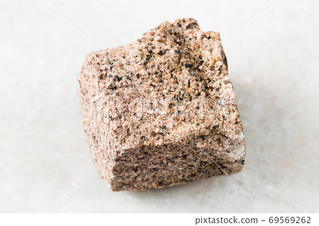 unpolished Aplite rock on white marble 69569262