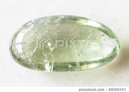 tumbled Prasiolite (green quartz) rock on white 69569341