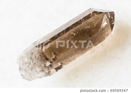 rough crystal of Smoky Quartz on white marble 69569347
