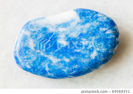 tumbled Lazurite (Lapis Lazuli) rock on white tumbled Lazurite (Lapis Lazuli) rock on white 69569351