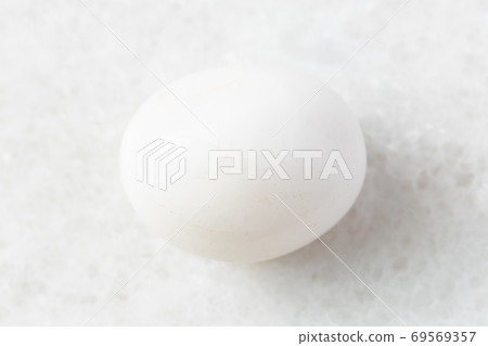 polished Milky Quartz rock on white marble 69569357