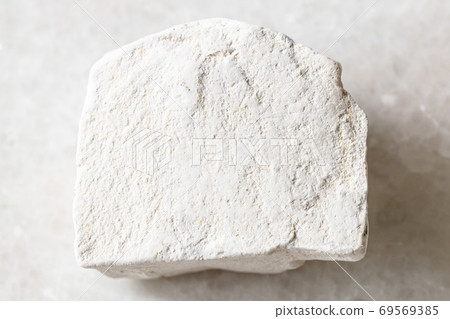 unpolished Chalk stone on white marble 69569385