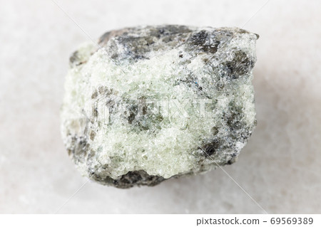 unpolished saccharoidal Apatite rock on white 69569389