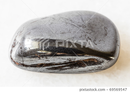 polished Hematite rock on white marble 69569547