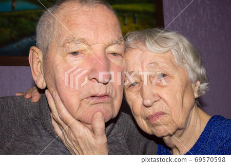 Portrait of a sad elder couple at home 69570598