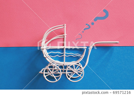 vintage baby stroller on a pink and blue background. Boy or girl question 69571216