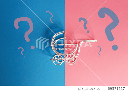 vintage baby stroller on a pink and blue background. Boy or girl question 69571217