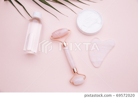 Selfcare, relaxation and beauty care concept. Modern apothecary or home spa composition on pink background Selfcare, relaxation and beauty care concept. Modern apothecary or home spa composition on pink background 69572020