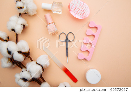 Professional steel manicure tools on pink table. Beauty care concept Professional steel manicure tools on pink table. Beauty care concept 69572037