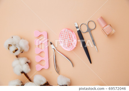 Beauty care concept. A set of professional tools for manicure and pedicure on pink background 69572046