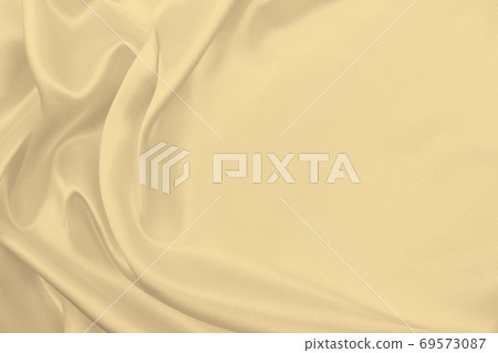 Smooth elegant golden silk or satin luxury cloth texture as wedding background. Luxurious background design. In Sepia toned. Retro style Smooth elegant golden silk or satin luxury cloth texture as wedding background. Luxurious background design. In Sepia toned. Retro style 69573087