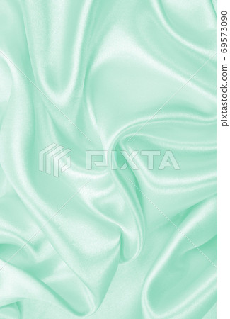 Smooth elegant green silk or satin luxury cloth texture as abstract background. Luxurious background design Smooth elegant green silk or satin luxury cloth texture as abstract background. Luxurious background design 69573090