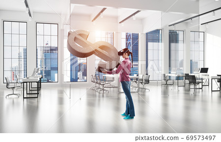 Girl in virtual reality mask experiencing virtual technology world. Mixed media Girl in virtual reality mask experiencing virtual technology world. Mixed media 69573497