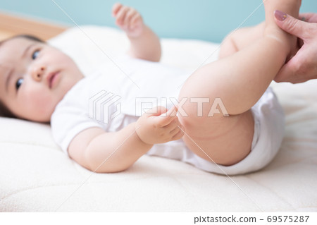 Baby Laid On The Floor Stock Photo