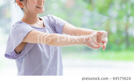 A refreshing woman stretching 69575628