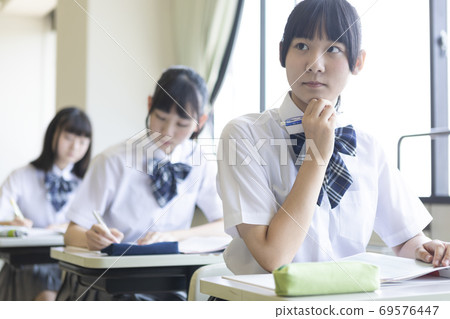 School girls studying 69576447
