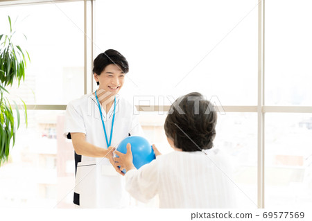 Senior woman rehabilitating and physiotherapist Senior woman rehabilitating and physiotherapist 69577569