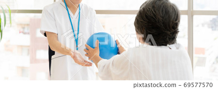 Senior woman rehabilitating and physiotherapist Senior woman rehabilitating and physiotherapist 69577570