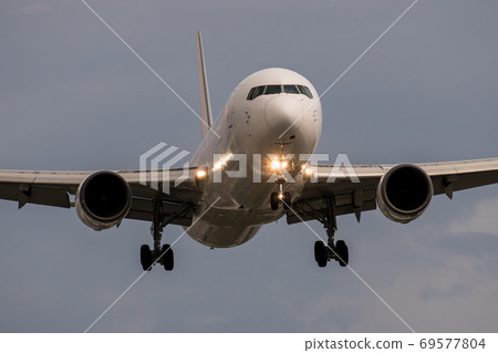 Taken from the front of an airplane ready for landing 69577804