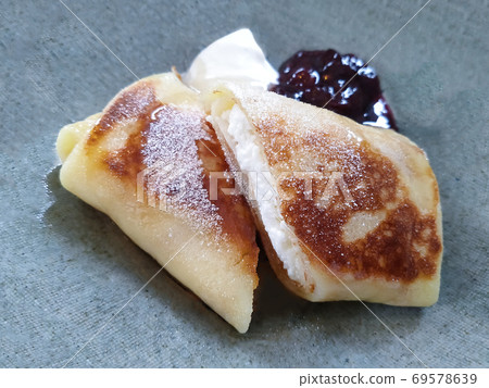 Dessert blini wrapped with cream cheese Dessert blini wrapped with cream cheese 69578639