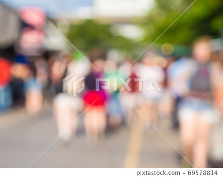 Crowed of anonymous business people walking on 69578814
