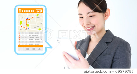 Image of a female office worker using a map / bus app on her smartphone 69579795