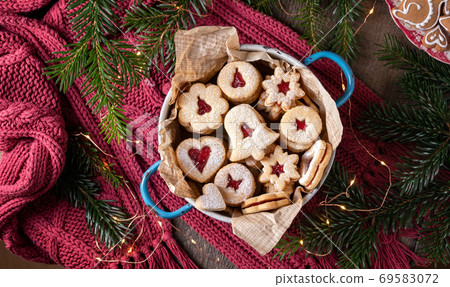Linzer Christmas cookies filled with red marmalade, top view 69583072