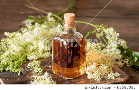 Meadowsweet tincture with fresh blooming meadowsweet 69583083