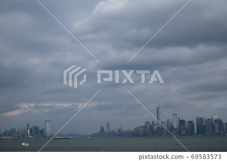 New York before the cold wave and the glowing Statue of Liberty New York before the cold wave and the glowing Statue of Liberty 69583573