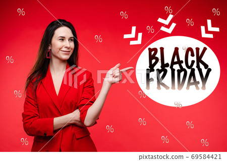 A portrait of a young girl points to a sign that A portrait of a young girl points to a sign that 69584421