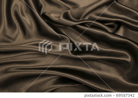 Smooth elegant brown silk or satin texture as abstract background. Luxurious background design. In Sepia toned. Retro style 69587342