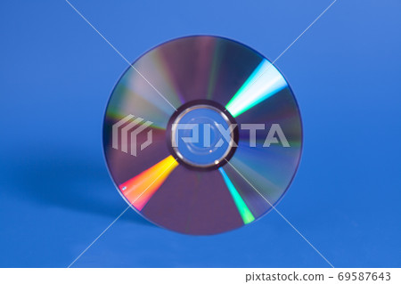 Compact disk on blue 69587643