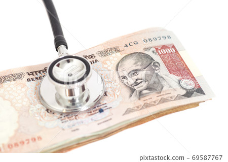 Stethoscope on indian 1000 rupee notes 69587767