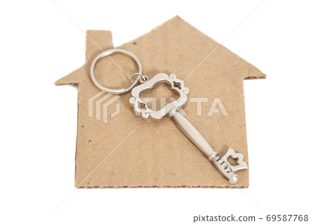 Paper house with key isolated on white Paper house with key isolated on white 69587768
