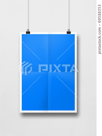Blue folded poster hanging on a white wall with clips Blue folded poster hanging on a white wall with clips 69588353