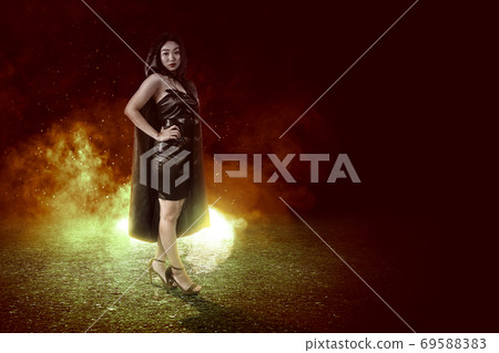 Asian witch woman with cloak standing 69588383
