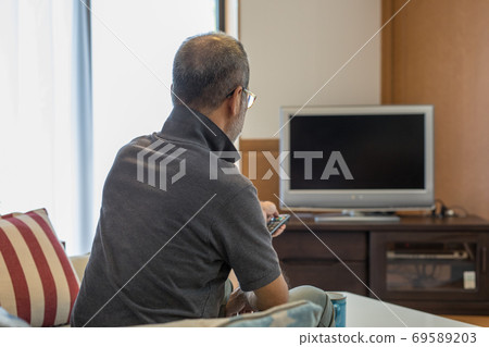 Watching sports on TV Watching sports on TV 69589203