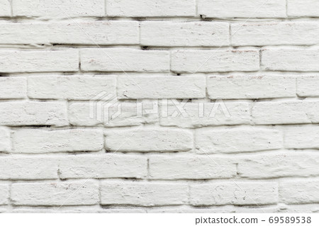 Front view of brick wall painted in white 69589538