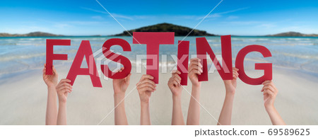 People Hands Holding Word Fasting, Ocean Background People Hands Holding Word Fasting, Ocean Background 69589625