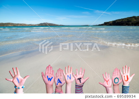 Children Hands Building Word I Want You, Ocean Background Children Hands Building Word I Want You, Ocean Background 69589934