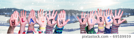 Children Hands Building Word Health First, Snowy Winter Background 69589939