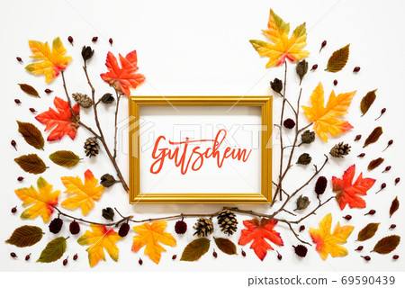 Colorful Autumn Leaf Decoration, Golden Frame, Text Gutschein Means Voucher Colorful Autumn Leaf Decoration, Golden Frame, Text Gutschein Means Voucher 69590439