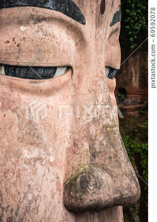 Close up of majestic Giant Leshan Buddha face 69592078