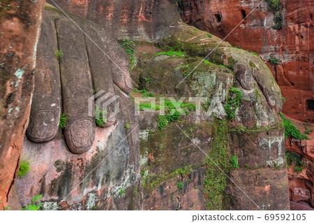 Close up of majestic Giant Leshan Buddha hands Close up of majestic Giant Leshan Buddha hands 69592105