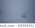 Dusk fog shelter. Surreal mystery atmosphere on the alpine meadow 69592432