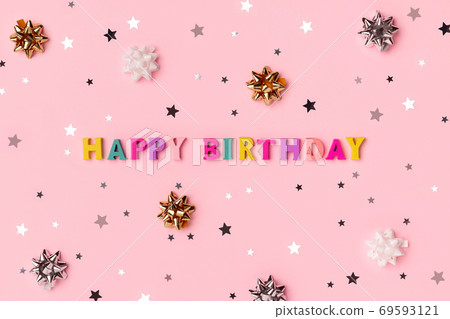 Happy birthday inscription from wooden colorful letters with confetti 69593121
