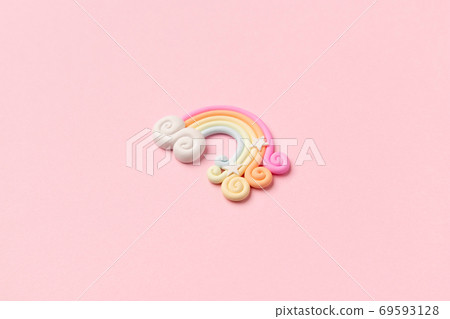 Rainbow pastel color arc on light pink background Rainbow pastel color arc on light pink background 69593128