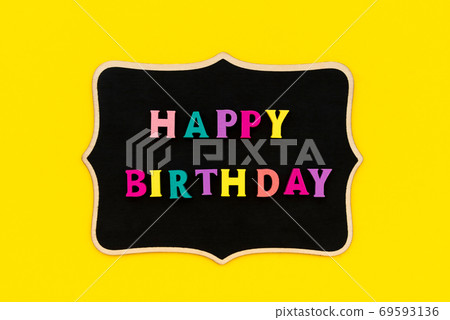 Happy birthday inscription from colorful letters on wooden board 69593136