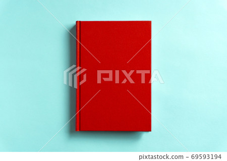 Red book on light blue background Red book on light blue background 69593194
