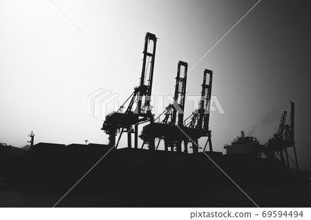 Gantry cranes silhouette photo, industrial cargo port 69594494
